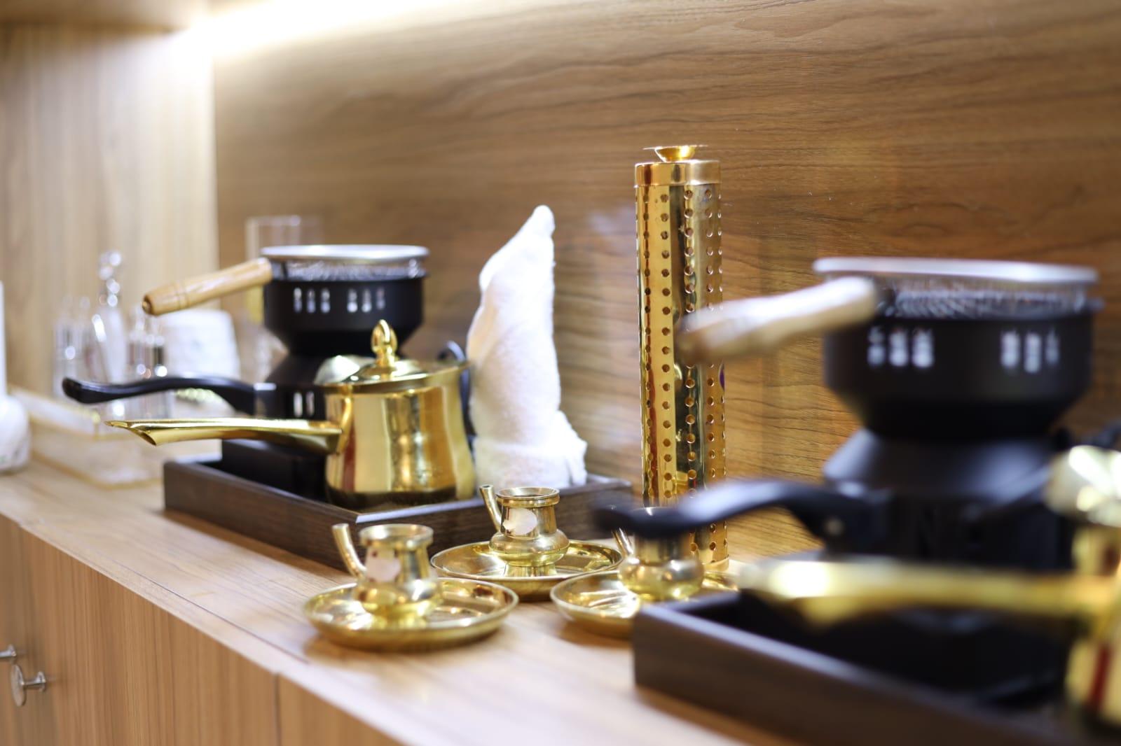 Traditional Arabic oil warmers and gold teapots